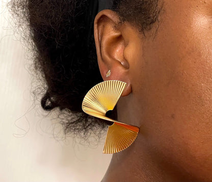 Gold-plated spiral earrings with a fan-shaped design.